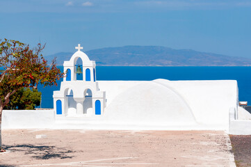 Bell towers of traditional church in Oia, Santorini island, Greece