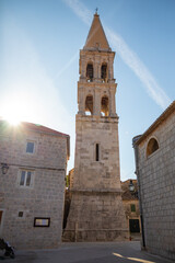 Fototapeta na wymiar Marble stone architecture at city center with Saint Stephan Church in Stari Grad, Croatia