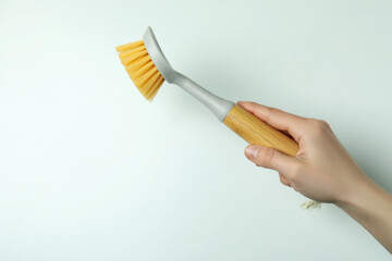 Female hand hold eco friendly brush on white background