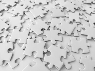 Messy white jigsaw puzzle pieces