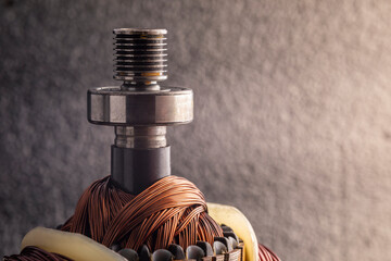 Belt pulley on the rotor of the electric motor. Copper motor windings.