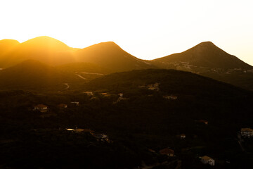 sunset over the mountains in Parga, Greece