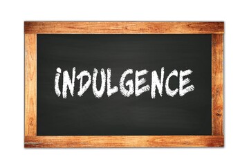 Fototapeta premium INDULGENCE text written on wooden frame school blackboard.
