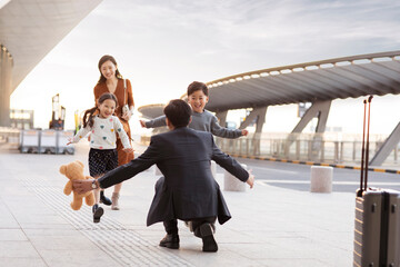 Happy young family at airport