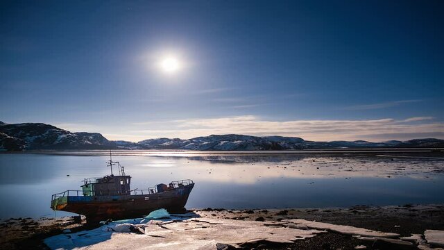 Abandoned ship in Arctica inder Moon and stars winter