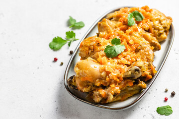 Stewed paprica chicken legs on a dish. Space for text, top view.