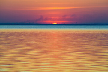 Bright beautiful sunset at the calm sea.