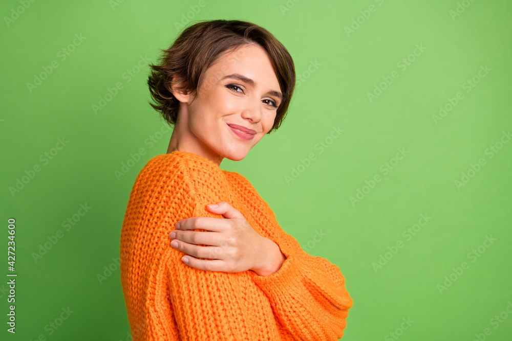 Sticker Profile side photo of happy nice woman hold hand shoulder comfort mood isolated on green color background