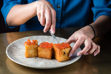 toasts with red caviar, foie gras ganache and fried brioche with red caviar