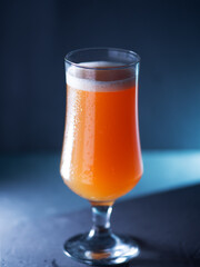 A glass of craft beer on a dark background