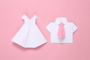 Origami wedding dress and shirt with tie on pink background