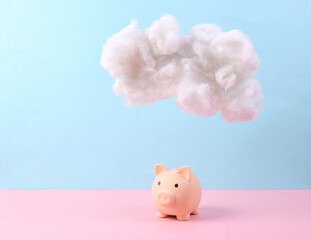 Piggy bank with cloud on pastel pink blue background. Invest or credit. Creative idea. Minimal concept. Pastel color trend
