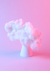 Floating fluffy cloud with cone in blue pink neon gradient light. Creative idea. Creative art. Minimalism