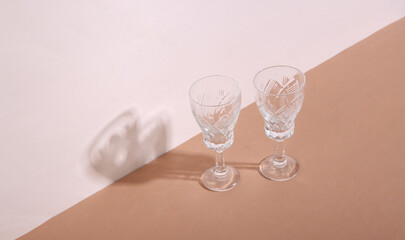 Creative still life. Retro glasses on beige brown  background. Minimalism. Trendy shadow.