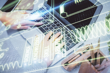 Double exposure of woman hands typing on computer and general theme hologram drawing. Education concept.