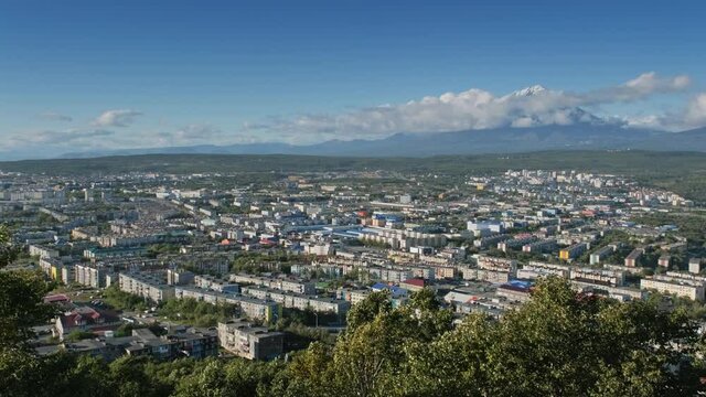 Petropavlovsk-Kamchatsky city and cone of volcano, Kamchatka Peninsula, Russia, 4k