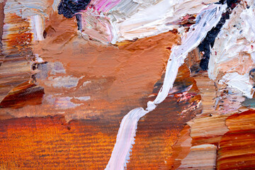 Embossed pasty oil paints and reliefs. Primary colors: brown, white, pink, orange. Abstract art. Mix of paints.