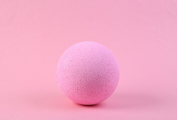 Pink ball on a pink background. Minimalism.
