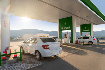 Cars at the biogas filling station. Carbon neutral transportation concept
