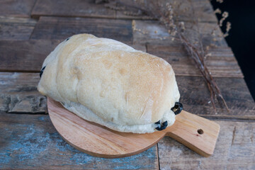 Fresh italian ciabatta bread with olive oil and olives.