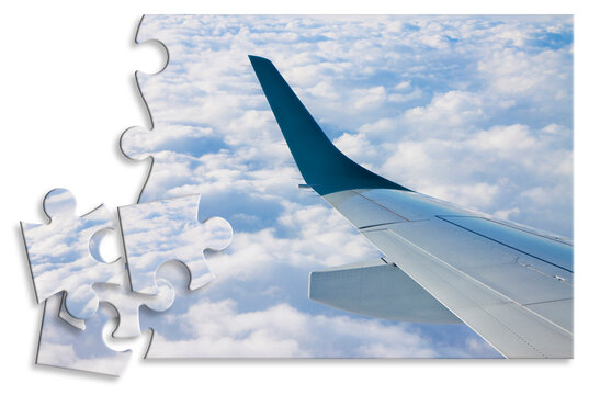 Airplane wing above the clouds in jigsaw puzzle shape - concept image which can mean: overcome fear of flying or solutions to air sickness or plan the trip by plane an so on