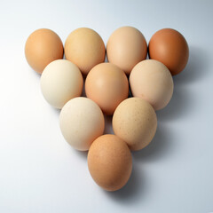 Eggs on white background with triangle shape