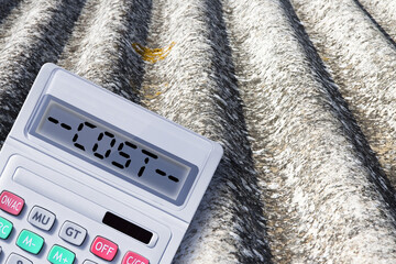 How much does it cost to remove asbestos? - Asbestos removal costs concept image with a dangerous...