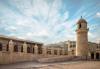 Old center, market and Al Ahmad Mosque in Doha. Islamic religion building. Souq Wakif is the popular traditional market in Doha, Qatar, Middle East.