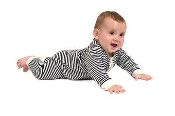  baby crawling on the floor looking away and smiling on white background