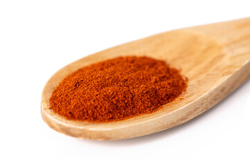 one spoon made of natural wood with aromatic seasoning on a white isolated background close-up