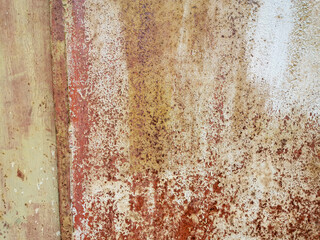 texture old yellow painted metal plate nailed rusting and crumbling