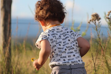 child playing in the field