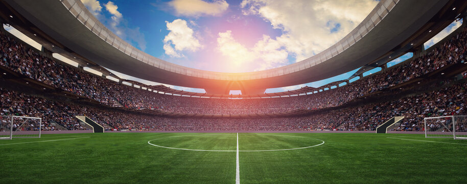 a soccer stadium in the summer in the sun