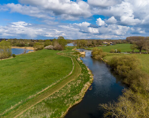 An aerial view down the River Nene on the outskirts of Thrapston, Northamptonshire in springtime
