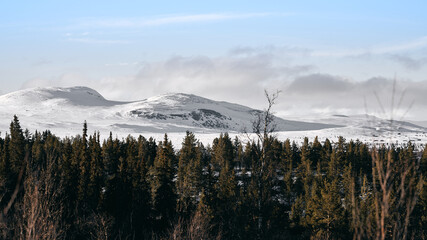 Landscape of the winter mountains in &Aring;l, Hallingdal, Norway. Shot in April in the evening. Summer is coming, but the snow is still covering the mountains. 