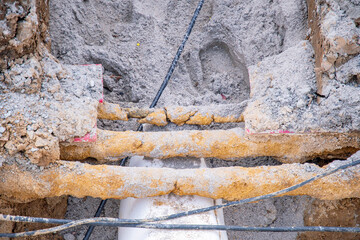 District heating pipes laid in black plastic pipes in construction site