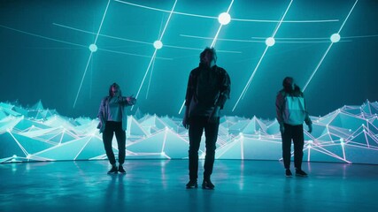 Diverse Group of Three Professional Dancers Performing a Hip Hop Dance Routine in Front of a Big Led Wall Screen with VFX Animation During a Virtual Production in Studio Environment