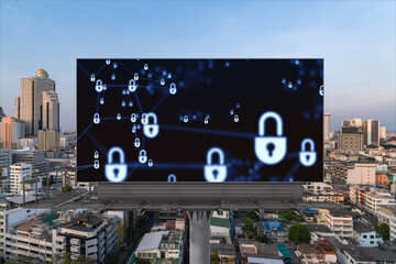 Padlock icon hologram on road billboard over panorama city view of Bangkok at sunset to protect business, Southeast Asia. The concept of information security shields.