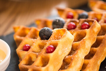 waffles with vanilla syrup for breakfast with berries