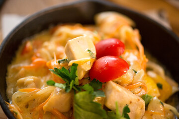meat cafe in a frying pan with herbs