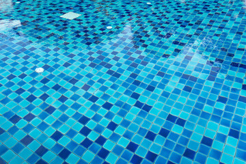 water rippled on swimming pool water surface for background
