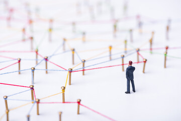 miniature people on complex web line connection