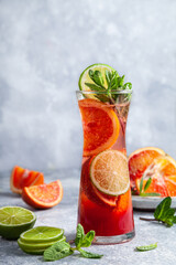 Fresh homemade lemonade with blood orange, mint and lime.