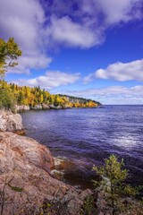 Blue sky and white puffy clouds over the bay on Lake Superior