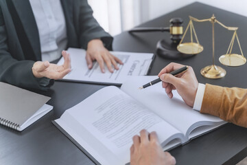 Lawyer discuss the contract and legal document agreement in office. Law and legal concept