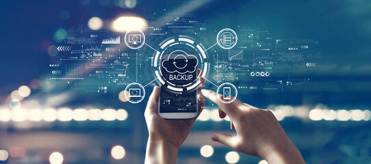 Backup concept with person using smartphone