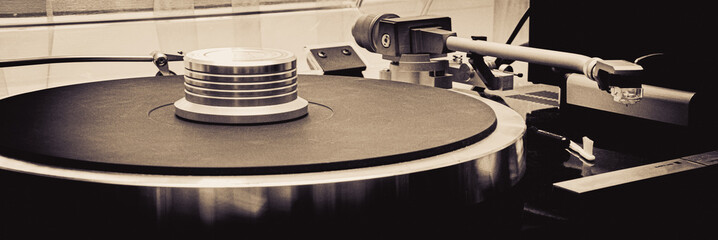 vinyl record player close up, black and white photo