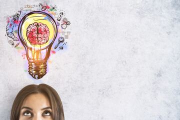 Woman looking at the brain inside a lightbulb colorful sketch on a white background with empty copyspace in the right, idea and innovation concept, mock up © Who is Danny