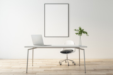 Blank white poster in black frame on light wall in eco style home office with wooden floor, light...