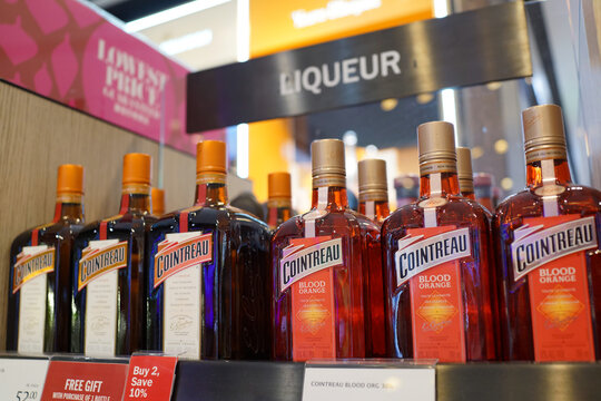 Cointreau brand liqueur display on store shelf in Changi Airport. Cointreau is an orange-flavoured triple sec liqueur produced in Saint-Barth&eacute;lemy-d'Anjou, France. Singapore - JAN 6, 2019.